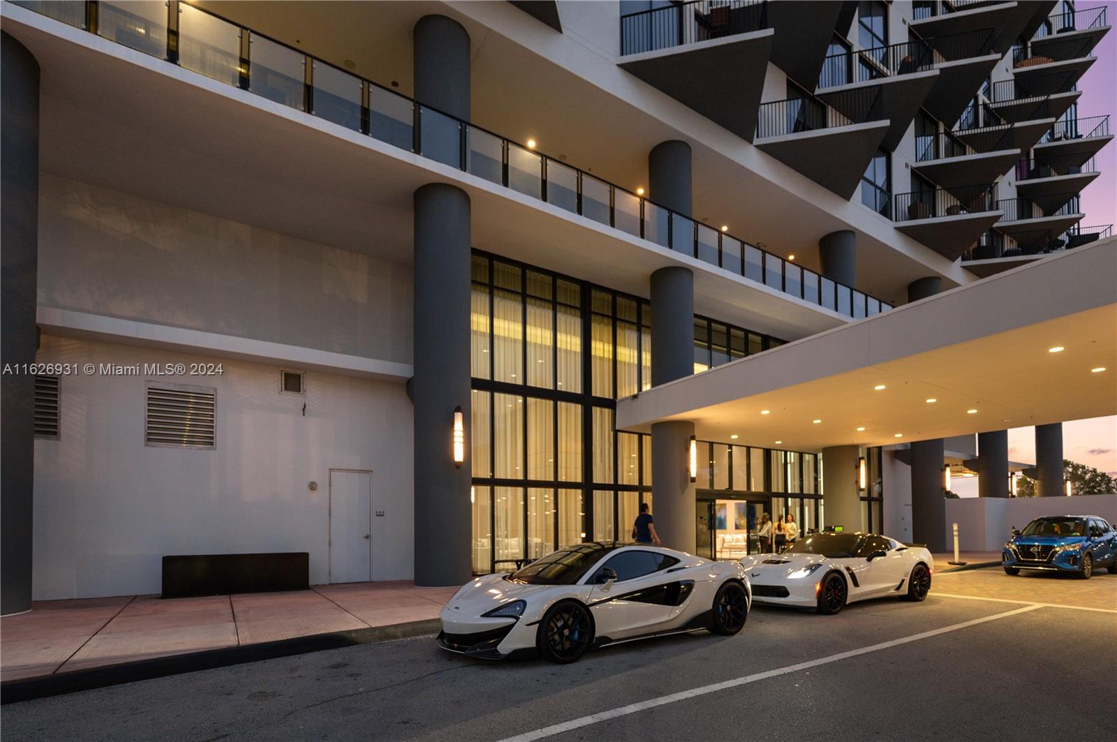 a view of a cars park in front of a building