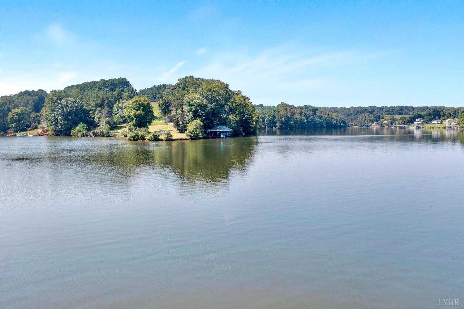 a view of a lake with houses in the back