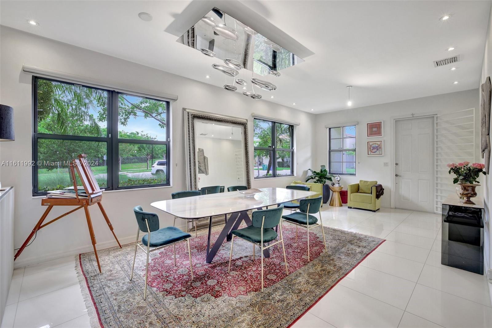 a view of a dining room with furniture window and outside view