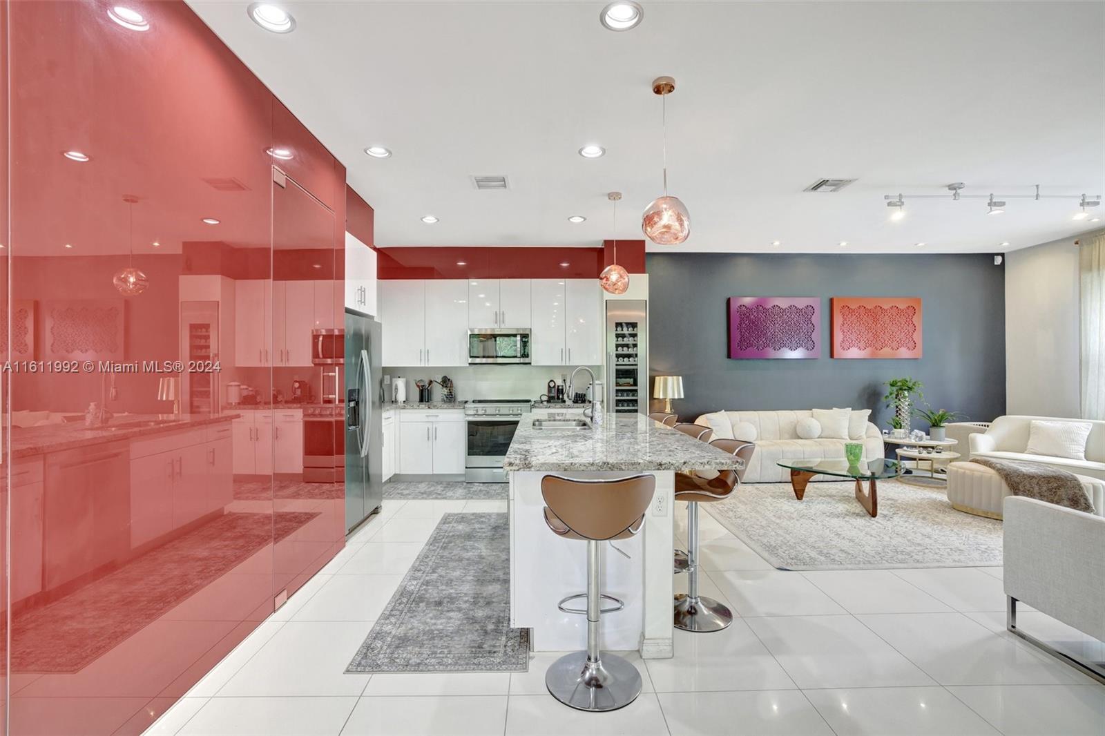 a dinning room and kitchen with a large window