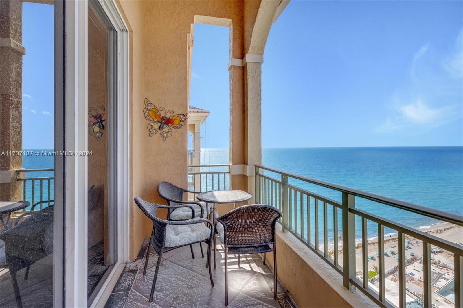 a view of a balcony with furniture