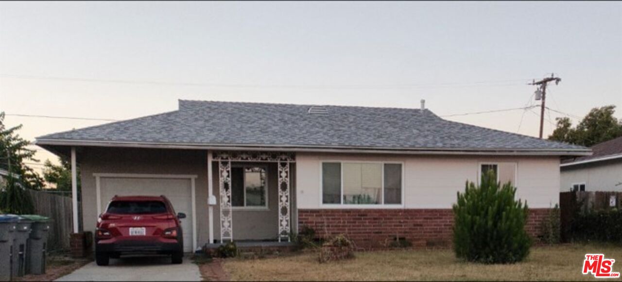 a car parked in front of a house