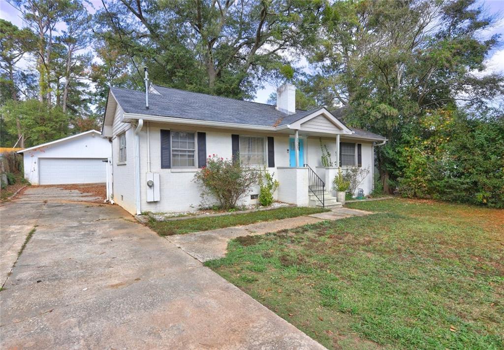 a front view of a house with garden