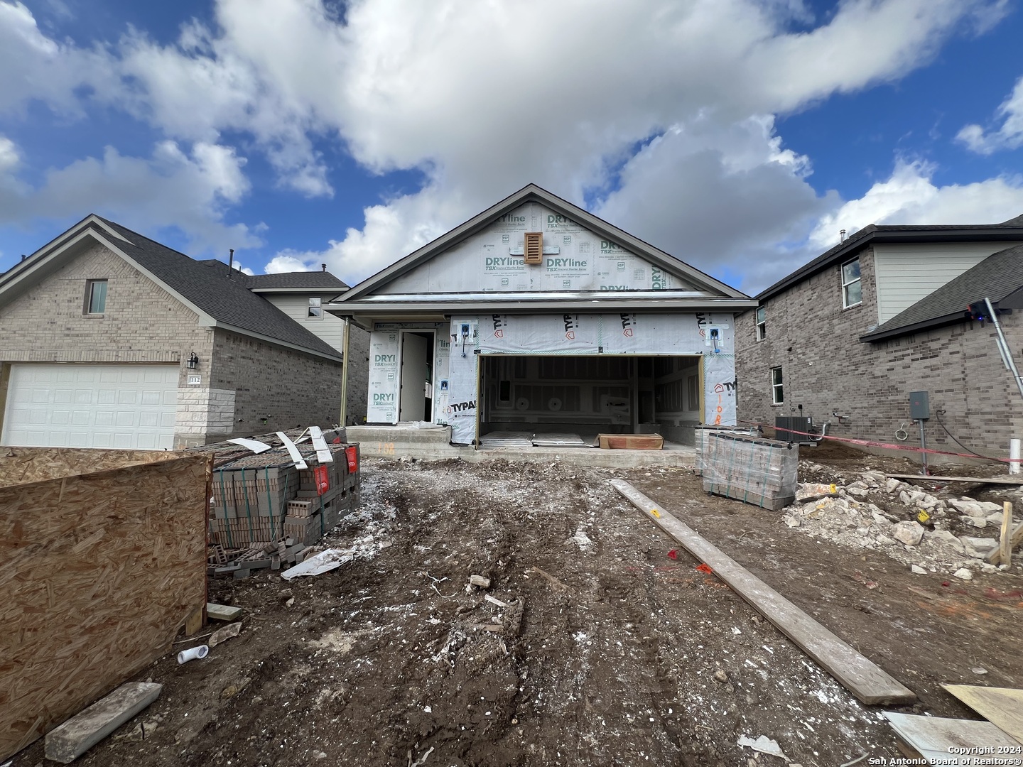 a front view of a house with yard