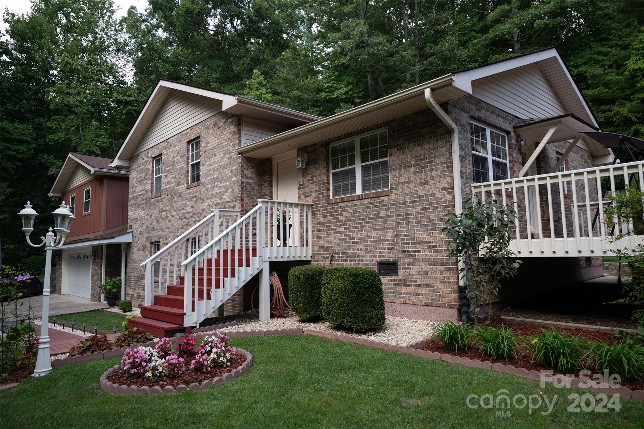 a front view of a house with garden