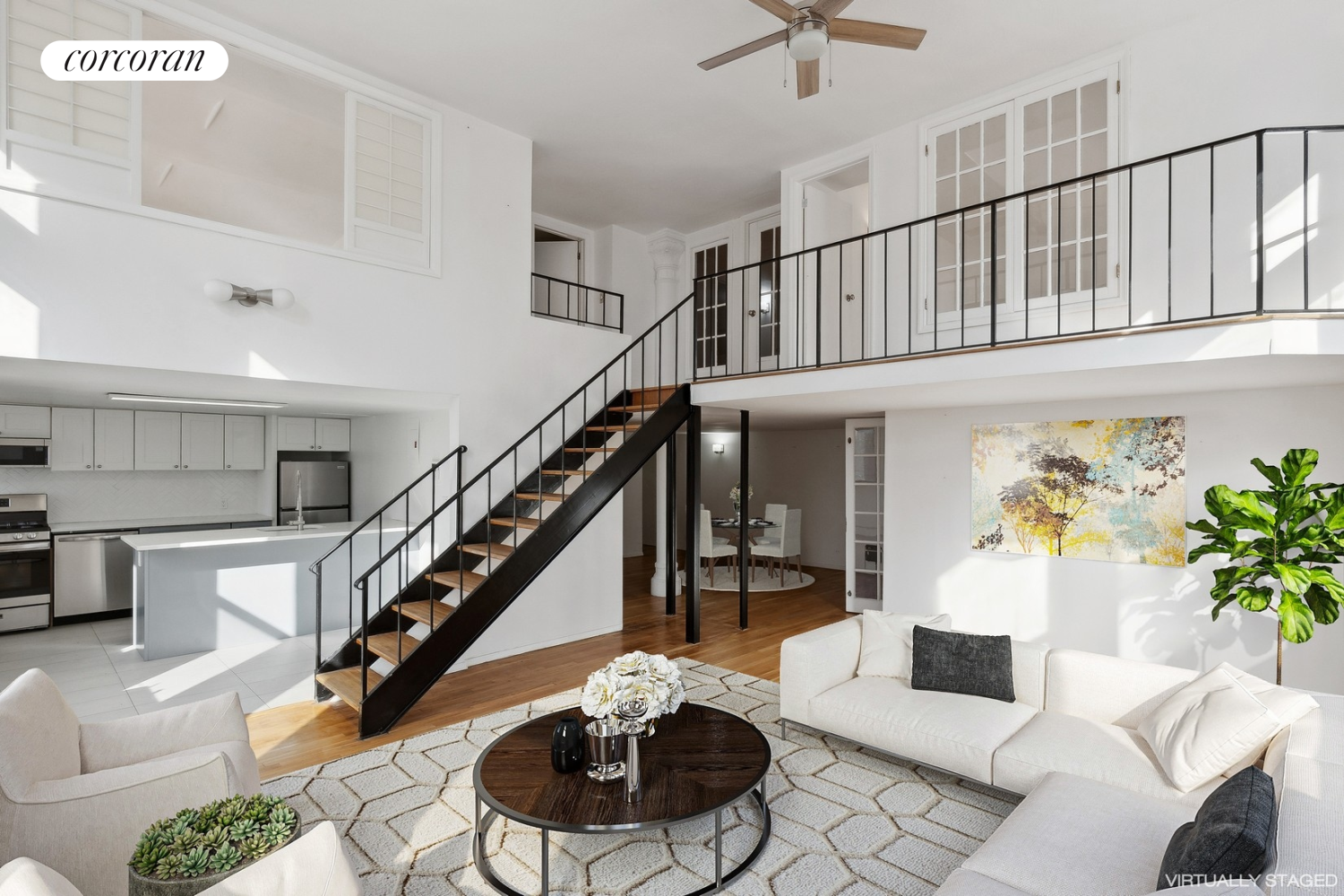 a living room with furniture and a potted plant