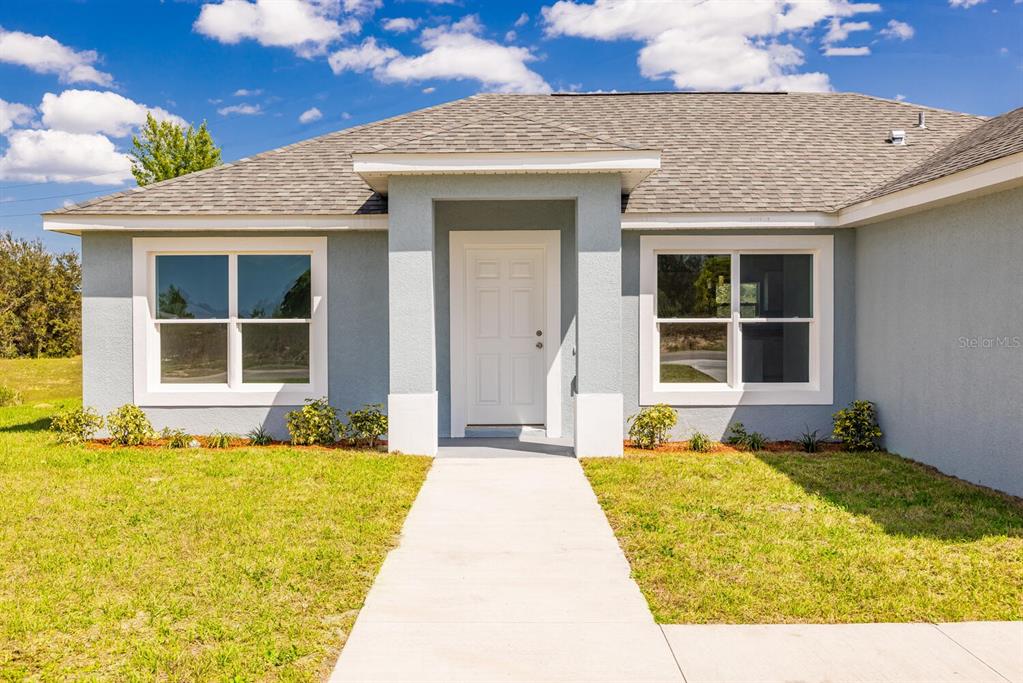 a front view of a house having yard