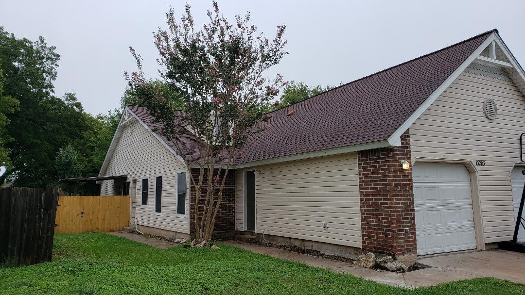 Street scene of the cottage style 1/2 Duplex with a garage and garage door opener