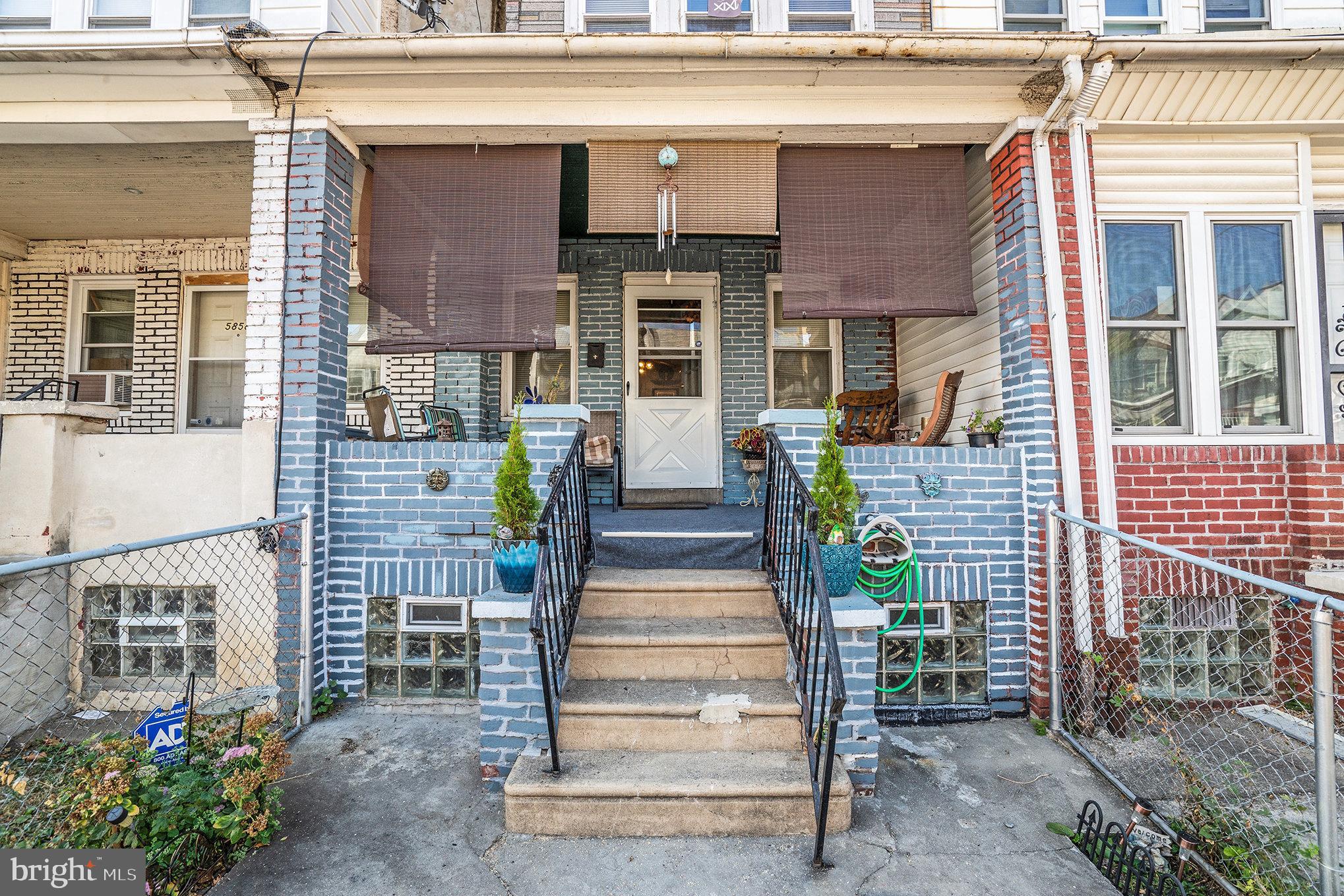 a front view of a house with stairs