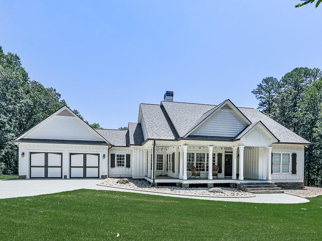 a front view of a house with a yard table and chairs