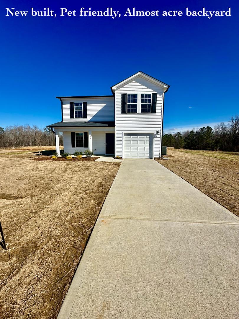 a view of a house with a yard