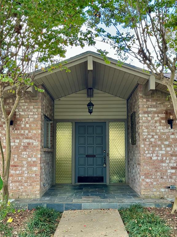 an entrance to house with yard