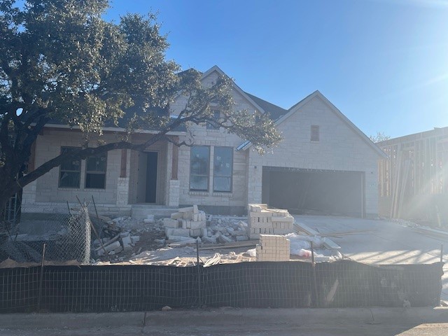 a front view of a house with yard