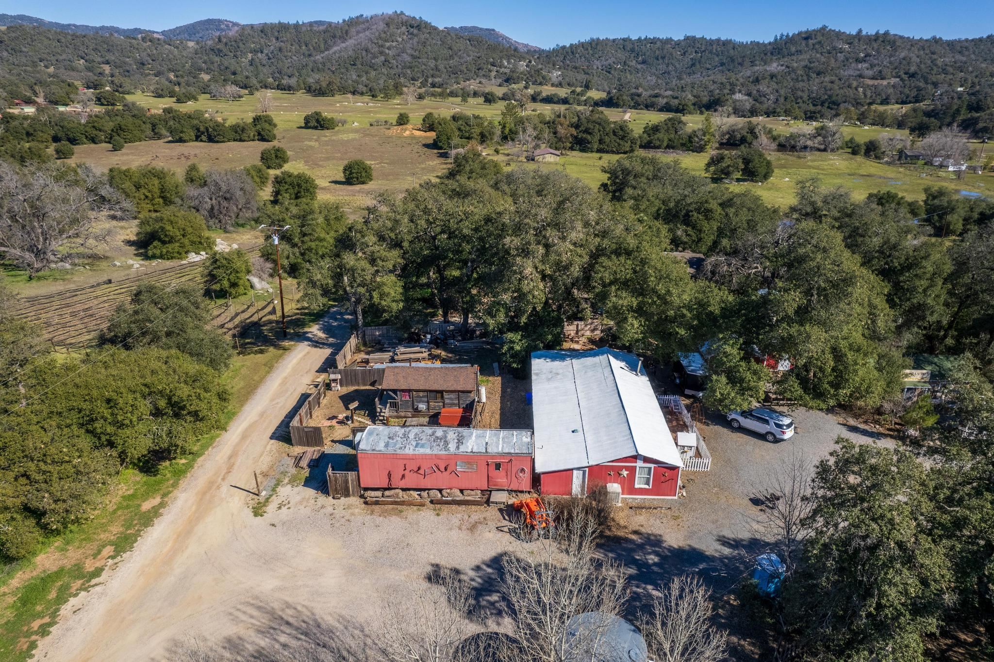 an aerial view of a house with pool and mountain view