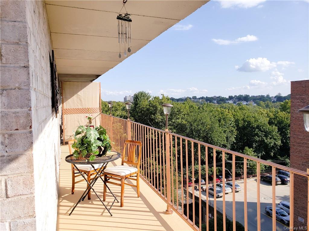 a view of balcony with furniture