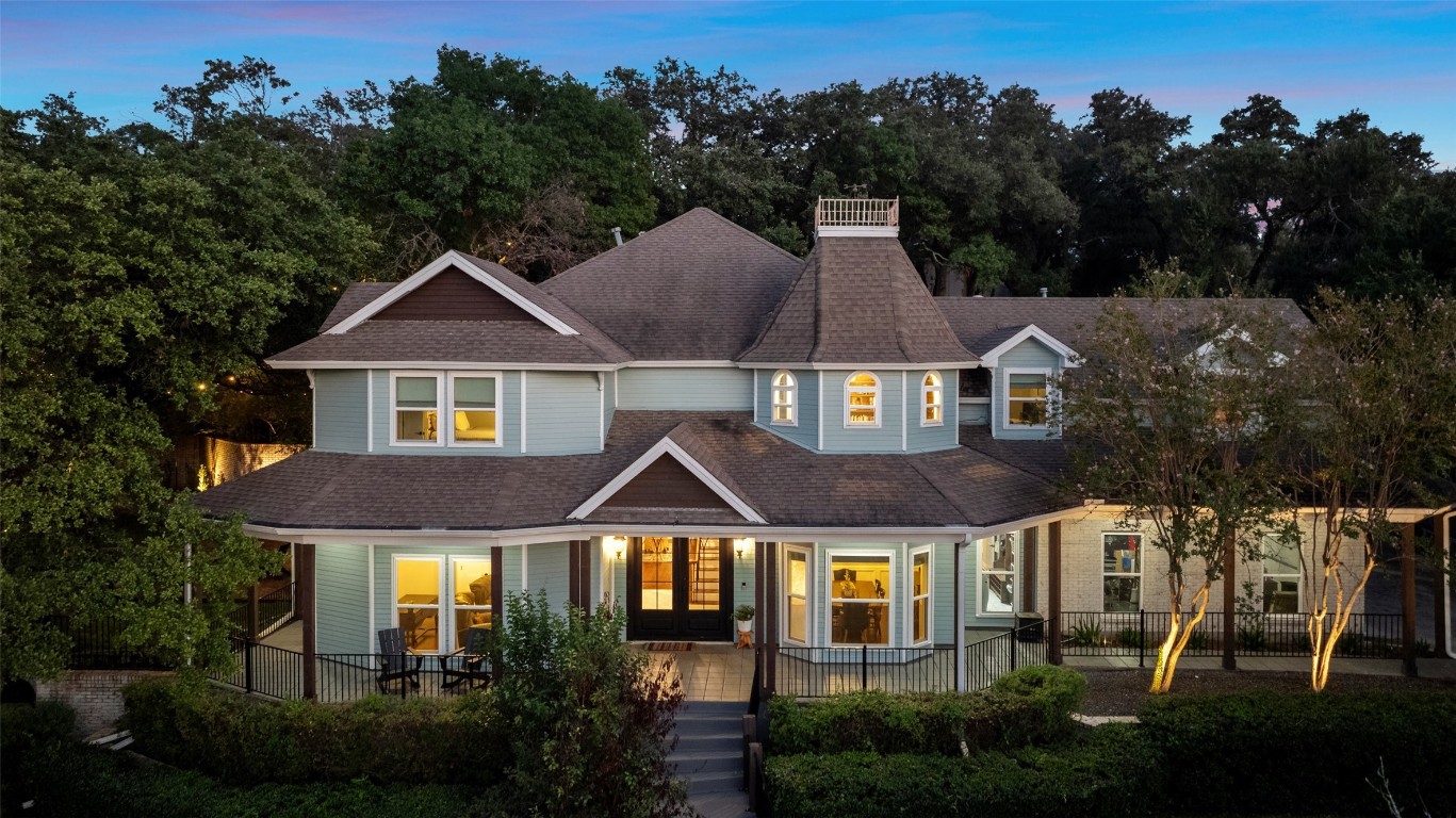 a aerial view of a house next to a yard