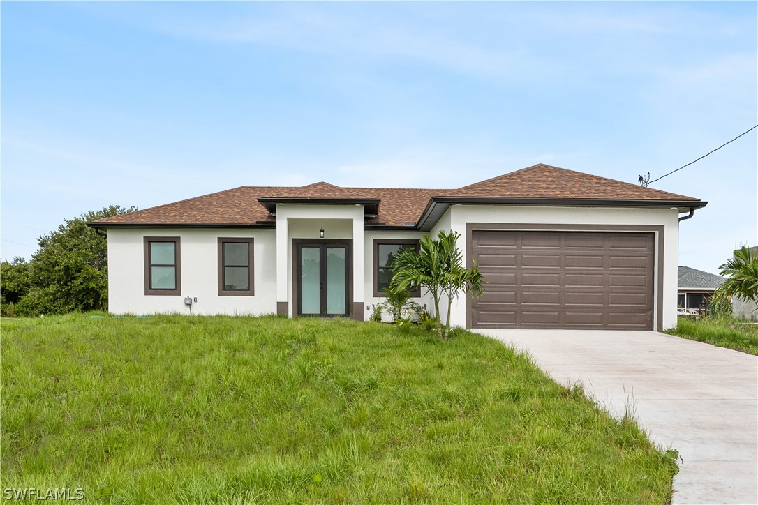 a front view of a house with a yard