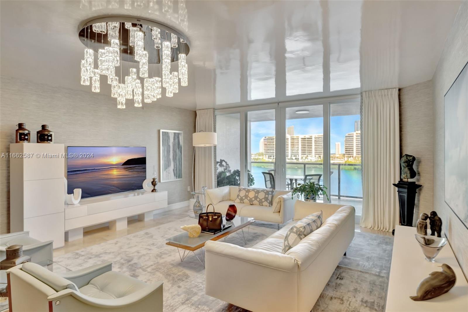 a living room with furniture a large window and a flat screen tv