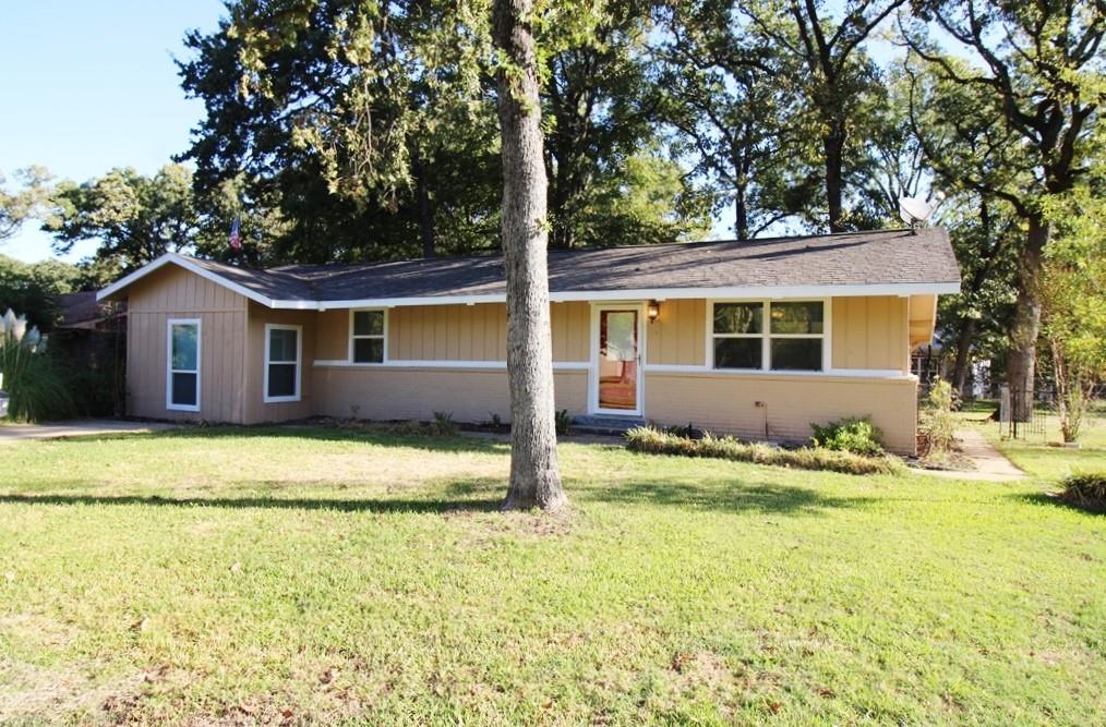 a house with trees in the background