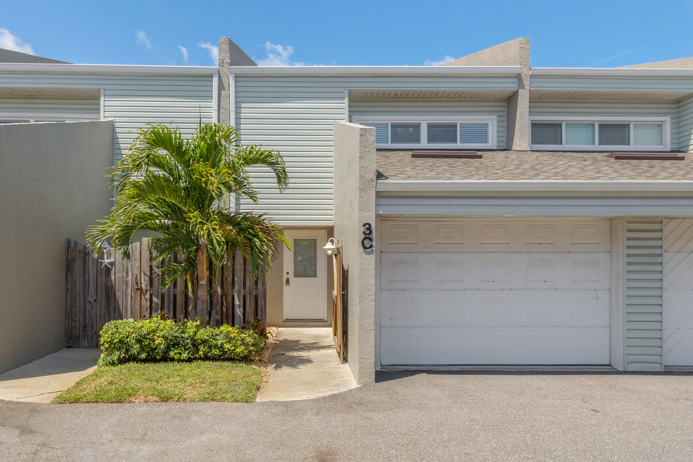 a front view of a house with a garage