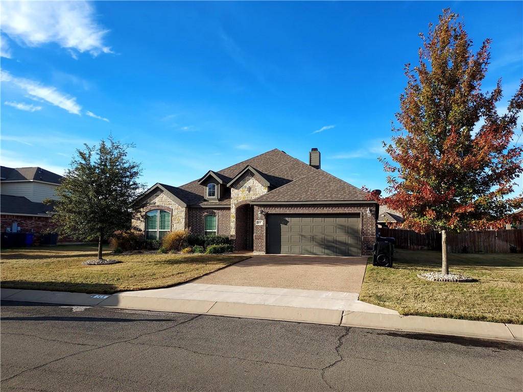 a front view of a house with a yard