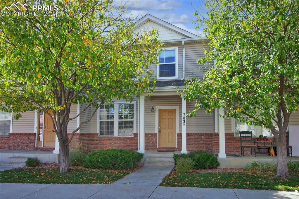 a front view of a house with garden