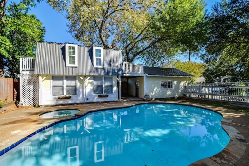 a view of a house with swimming pool