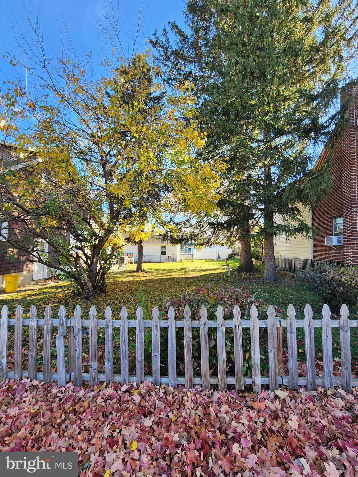 a front view of building with trees