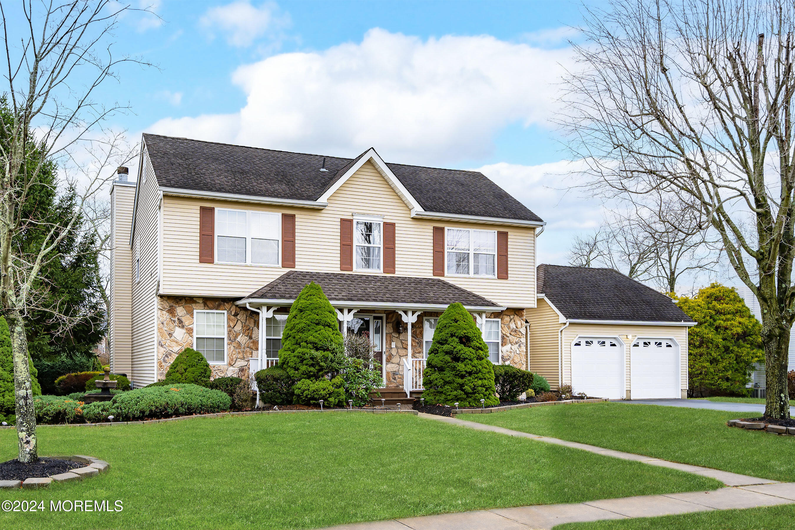 a front view of a house with a yard