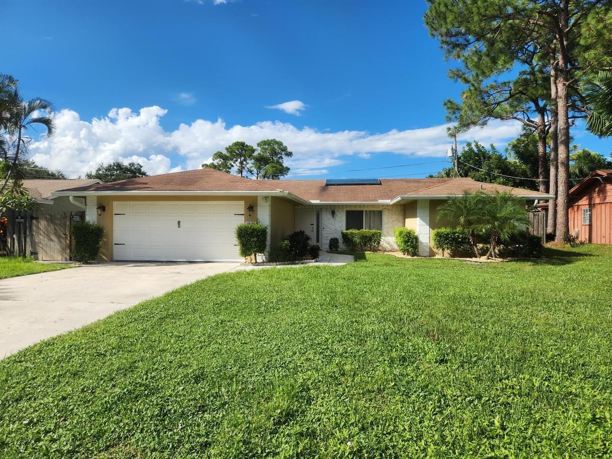 front view of a house with a yard