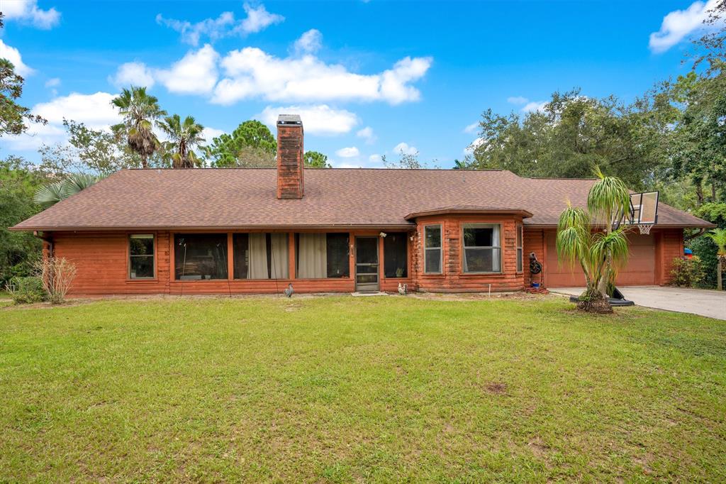 a front view of a house with a garden and porch