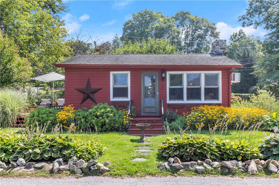 a view of a brick house with a yard