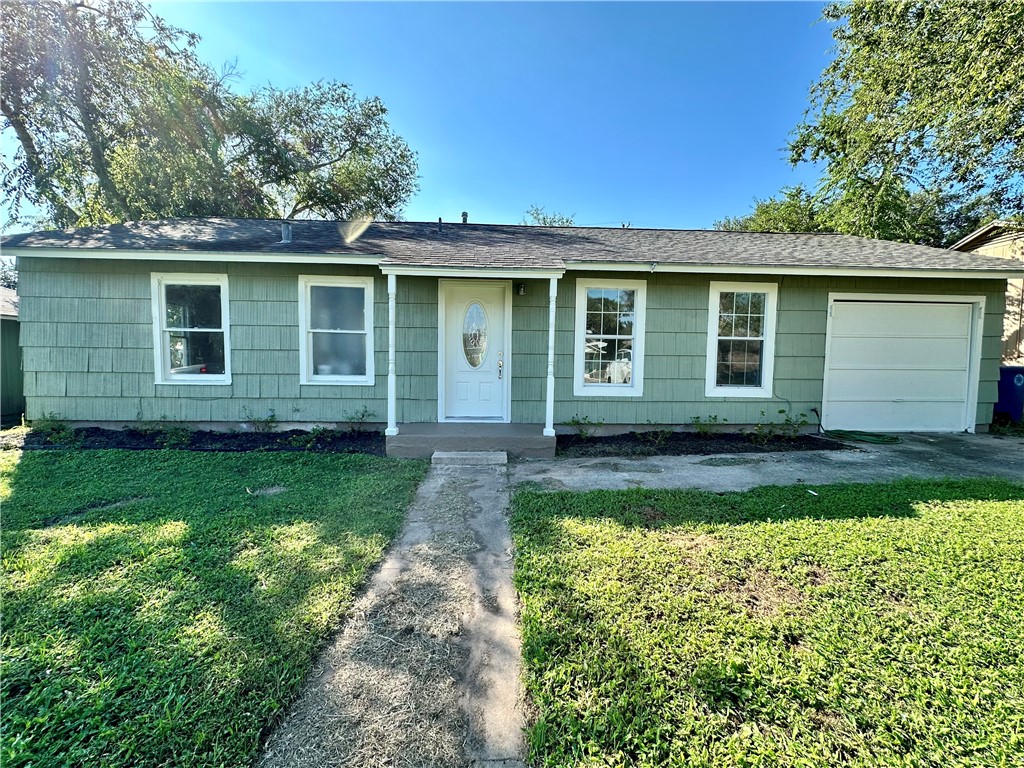 front view of a house with a yard