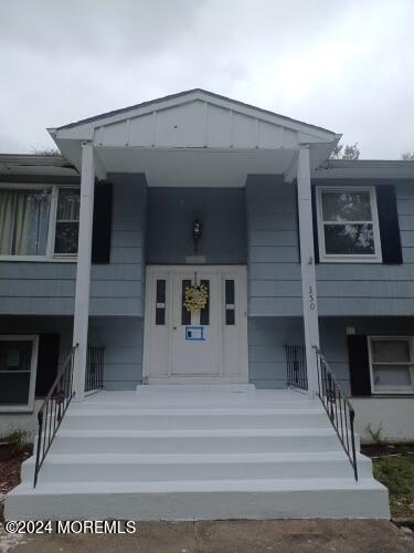 a front view of a house with a balcony