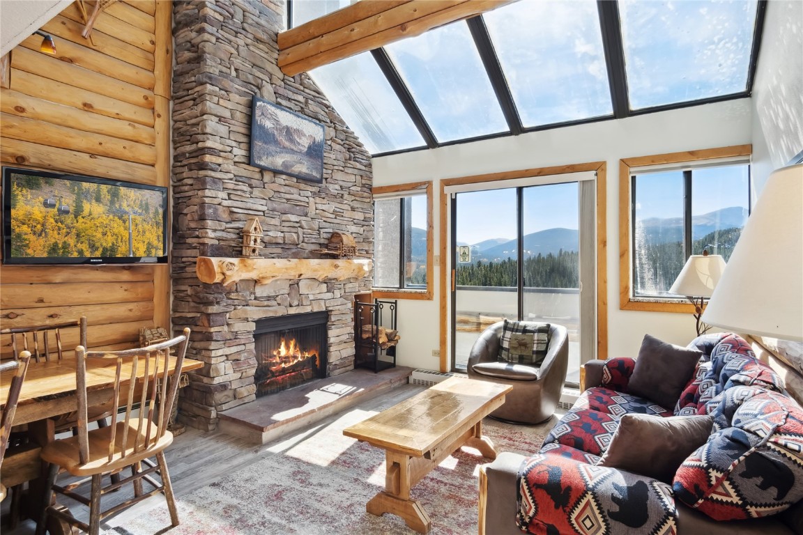 a living room with furniture fireplace and flat screen tv