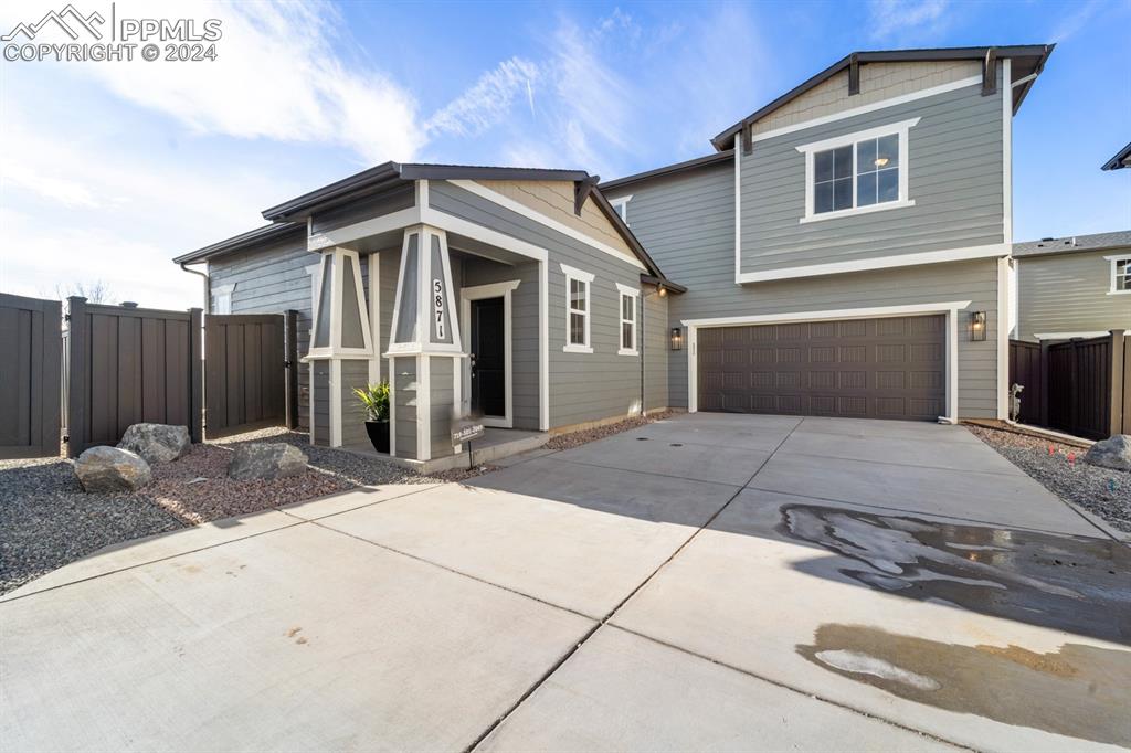 a front view of a house with a garage