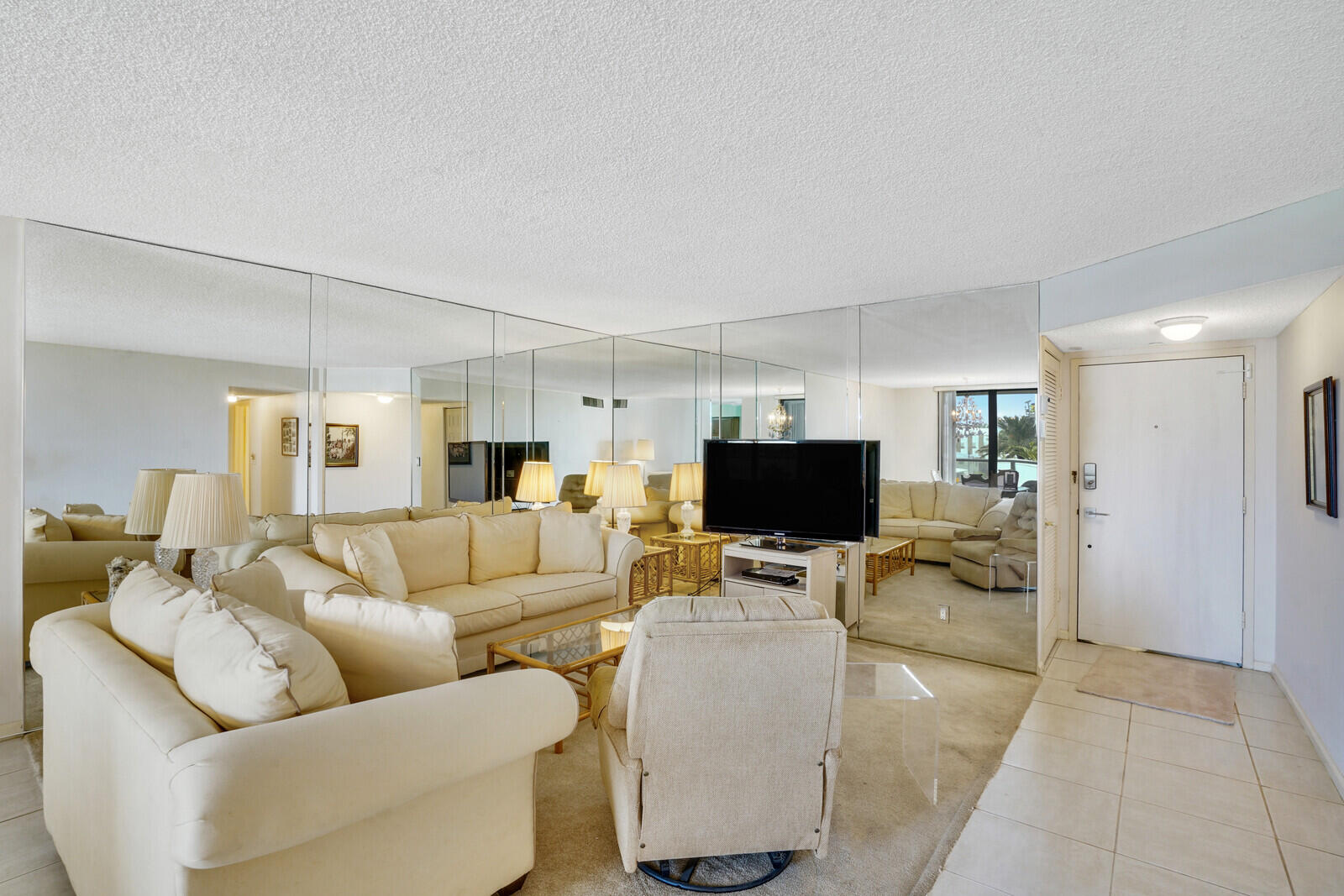 a living room with furniture and a flat screen tv