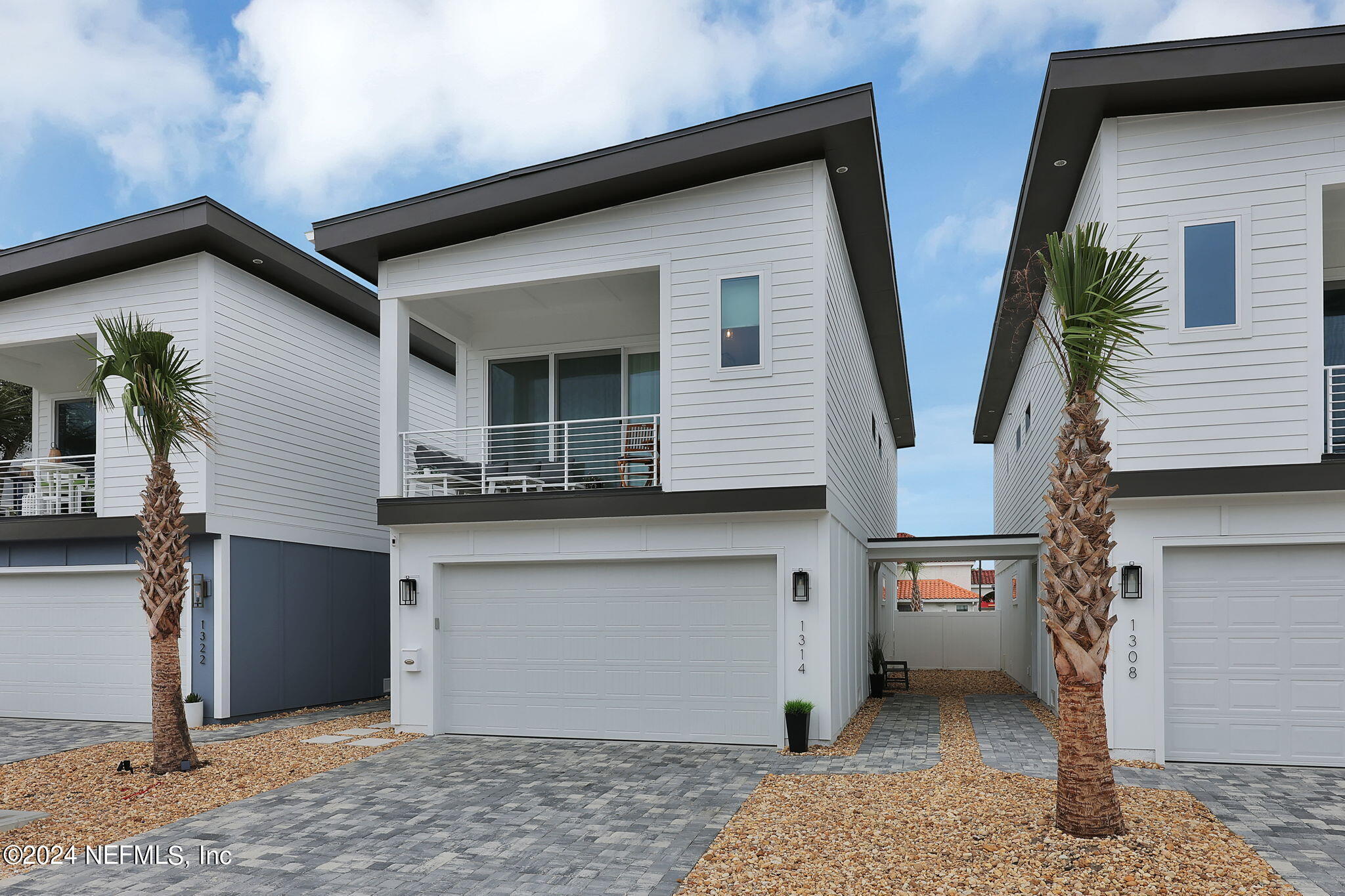 a front view of a house with garage