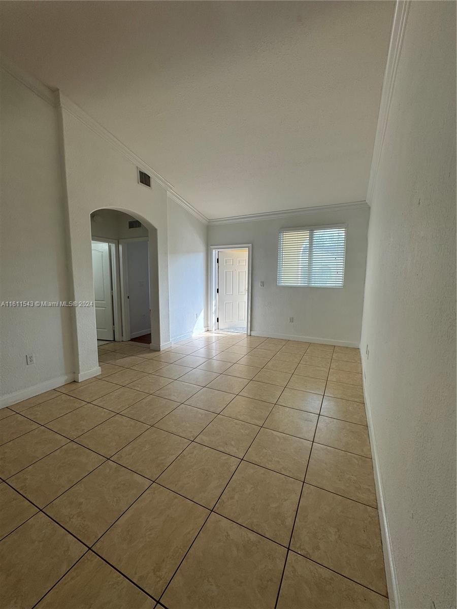 a view of an empty room and window