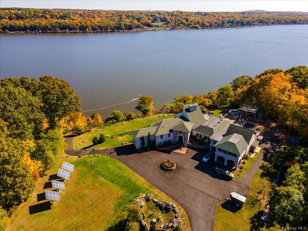 an aerial view of a house with a lake view