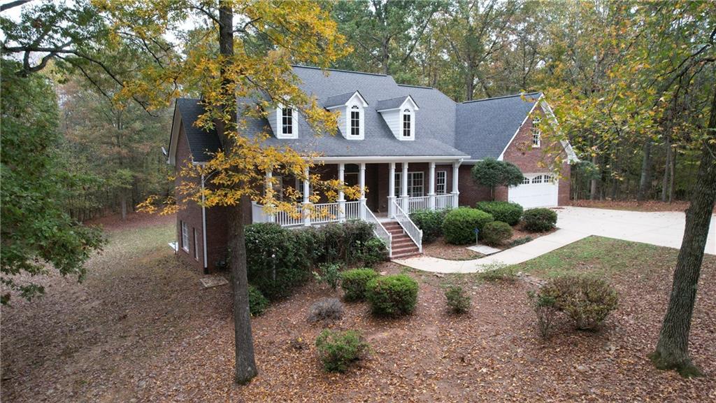 a front view of a house with a yard and pathway