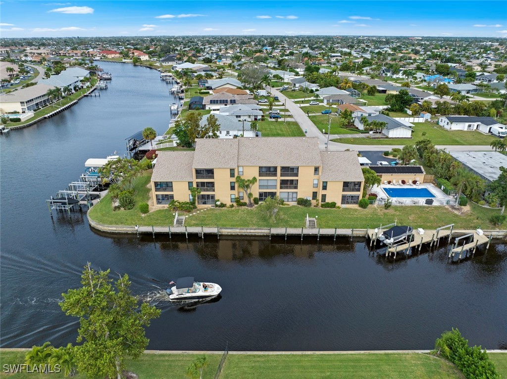 an aerial view of a house with a lake view