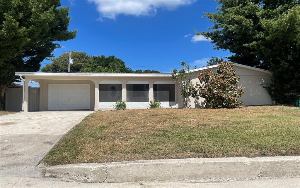 front view of a house with a yard