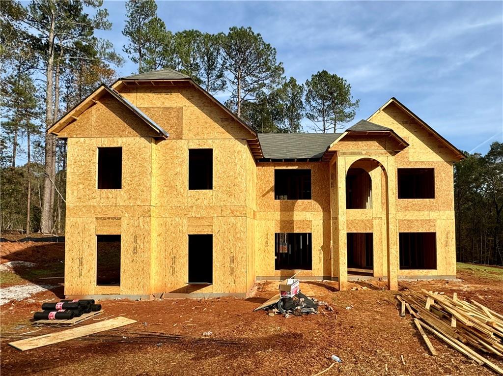 a front view of a house with yard