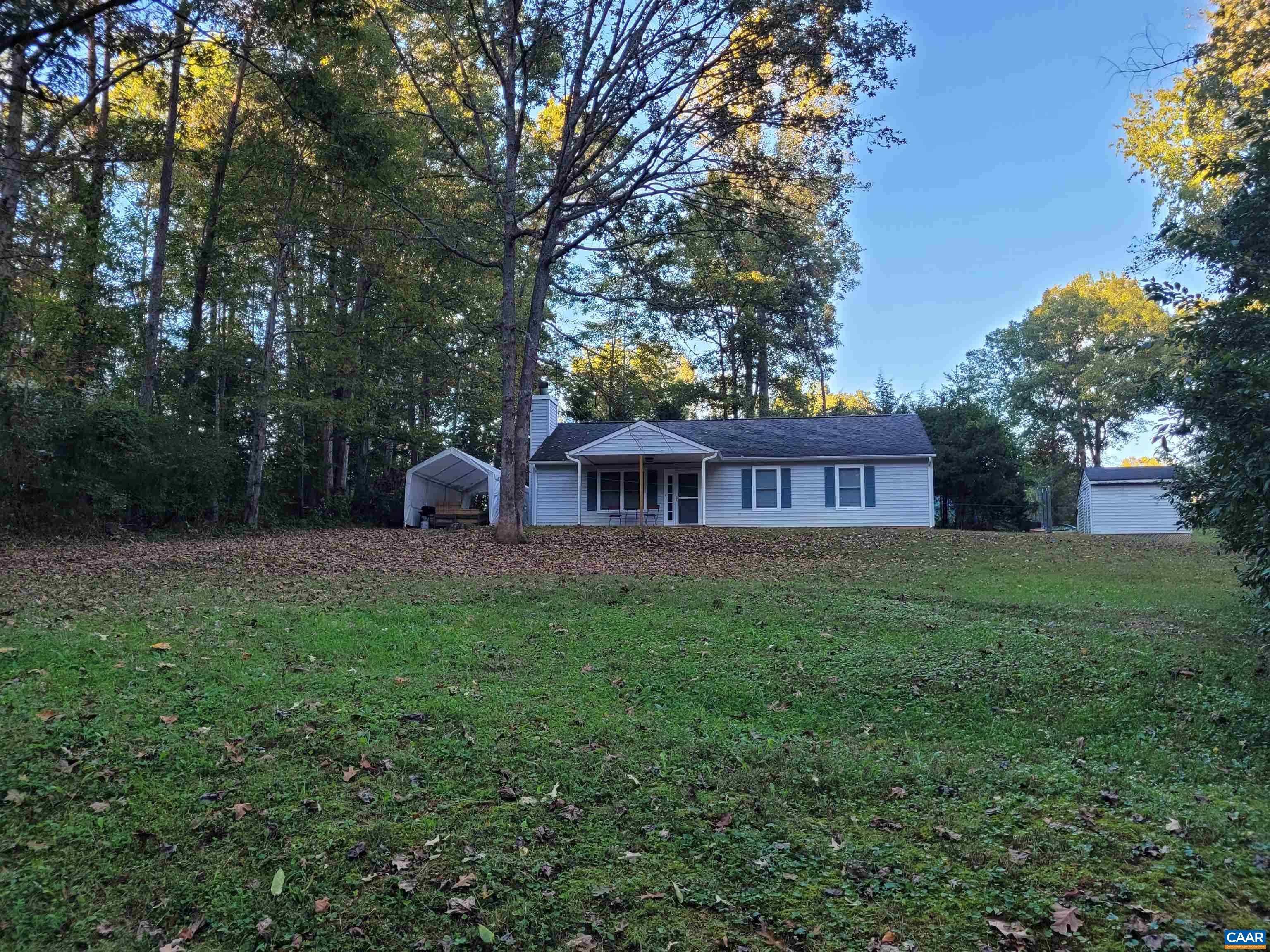 a view of a house with a yard