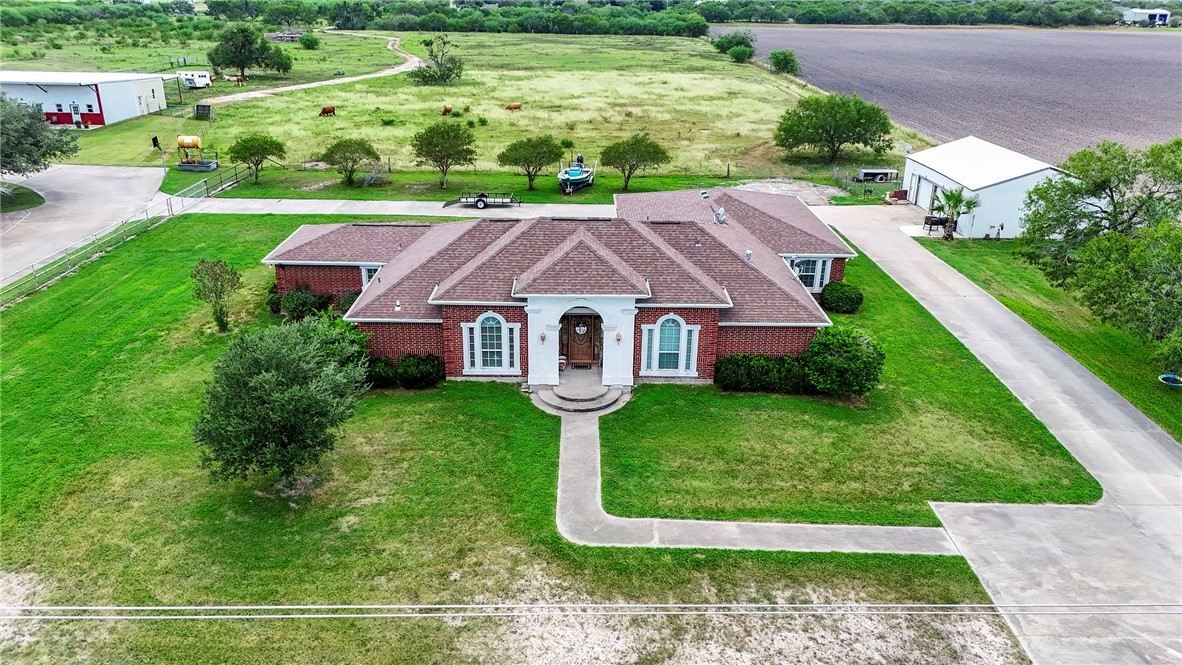 a aerial view of a house with garden