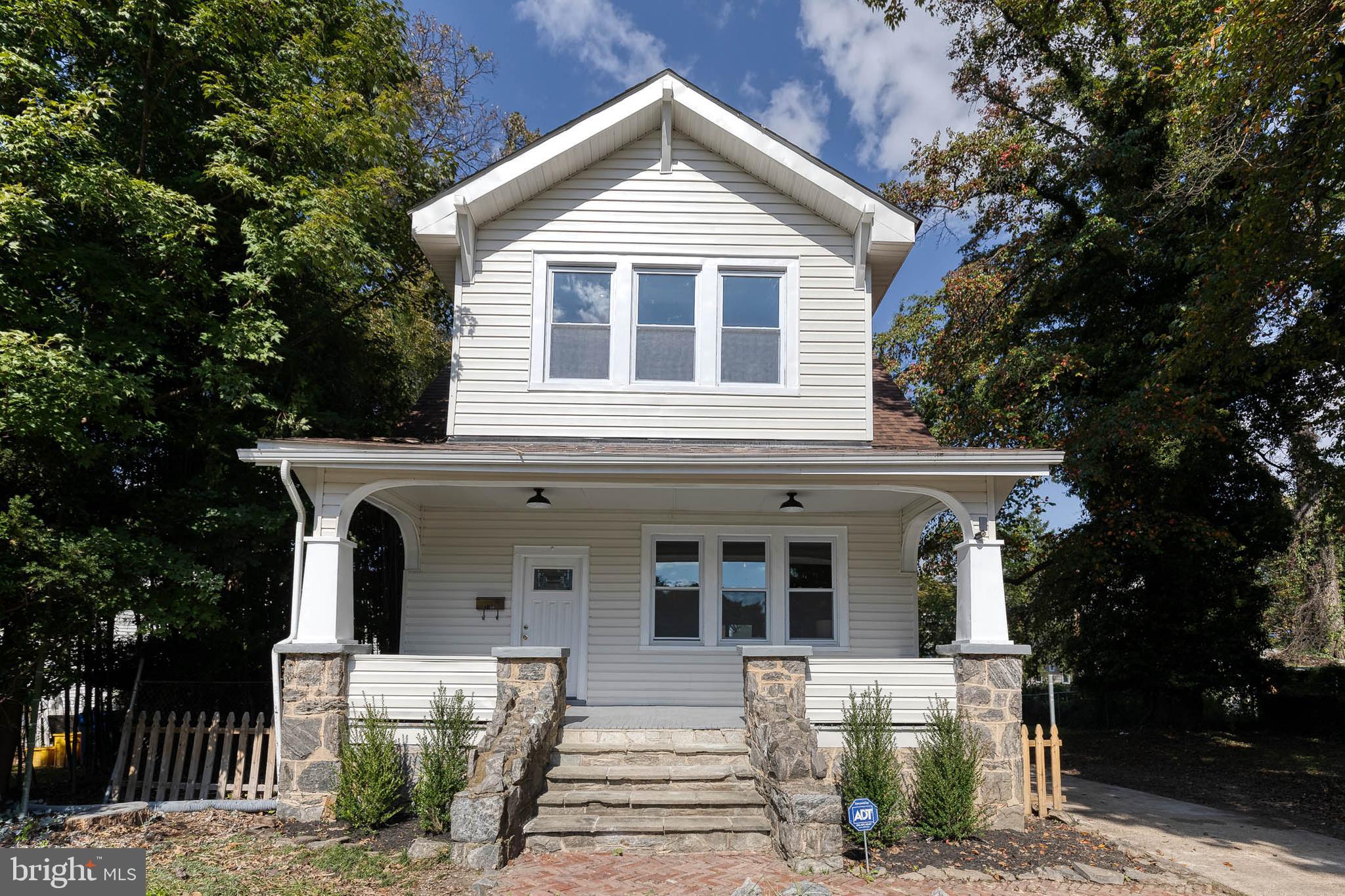 a front view of a house with yard