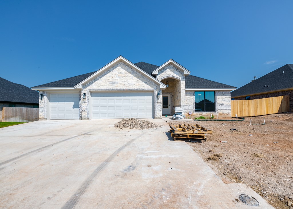 a front view of a house with parking