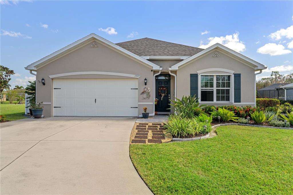 a front view of house with a yard and garage