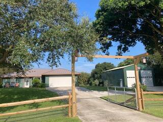 front view of a house with a tree